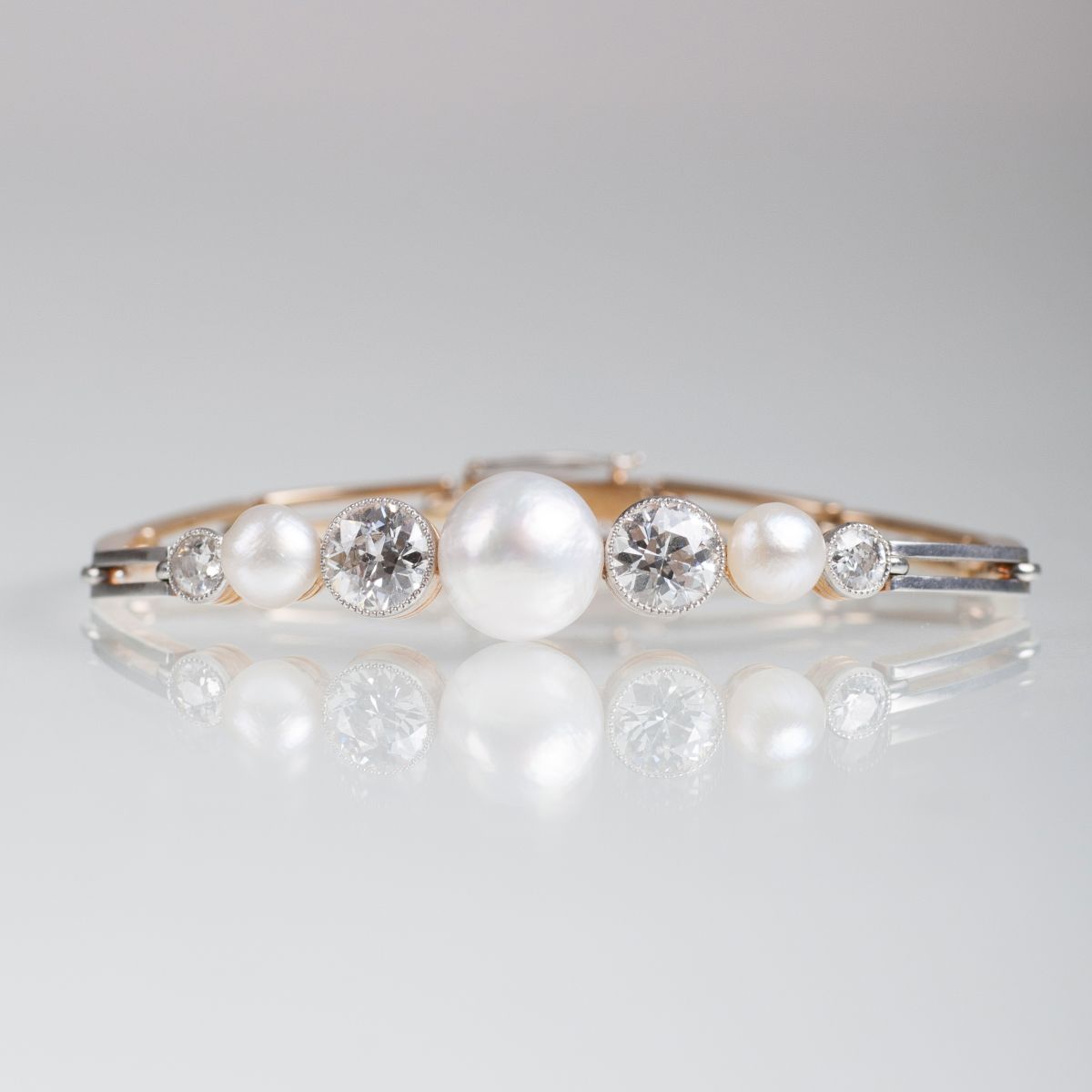 - A fine Art Nouveau bangle bracelet with pearls and old cut diamonds A fine Art Nouveau bangle bracelet with pearls and old cut diamonds