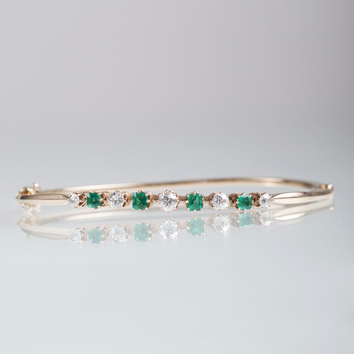 A Vintage bangle bracelet with emeralds and diamonds