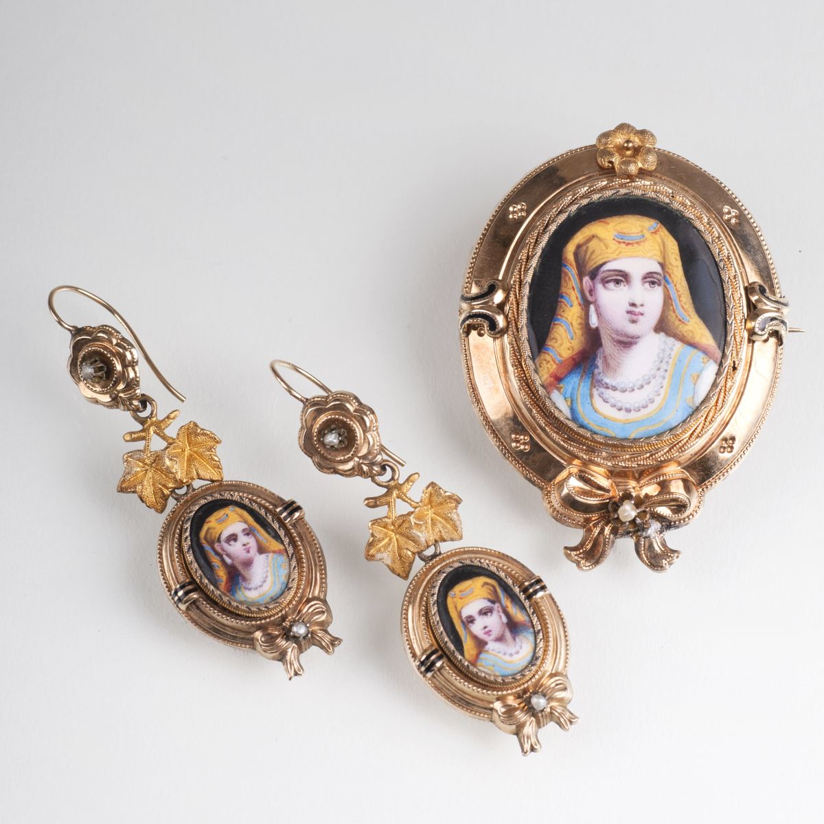 An antique demi parure with oriental enamel paintings