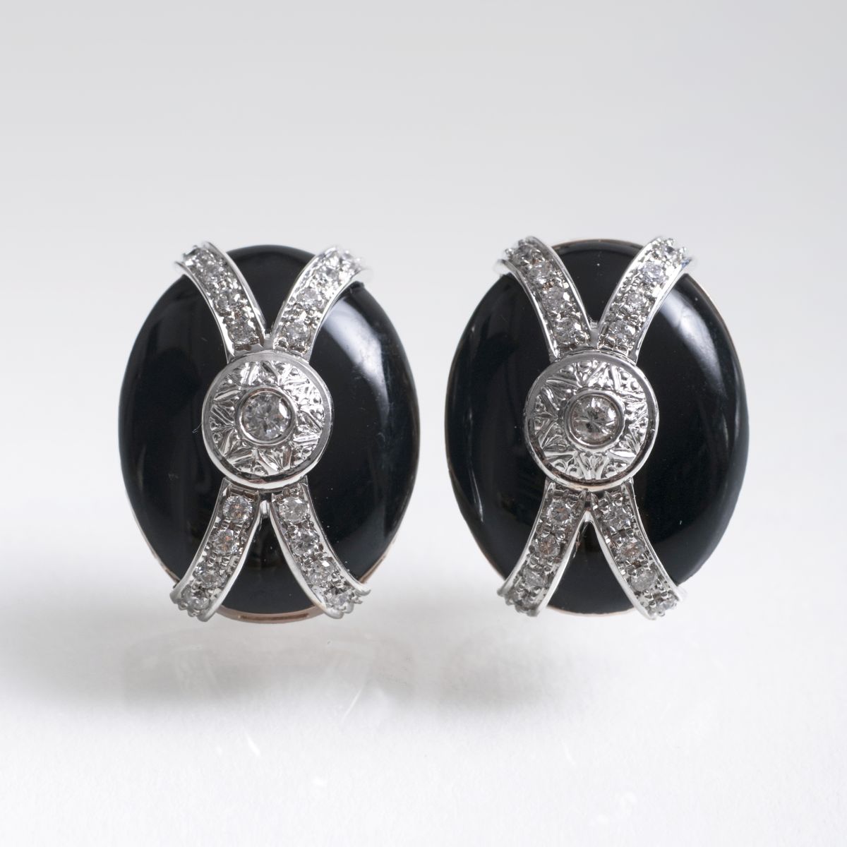 A pair of onyx diamond earrings