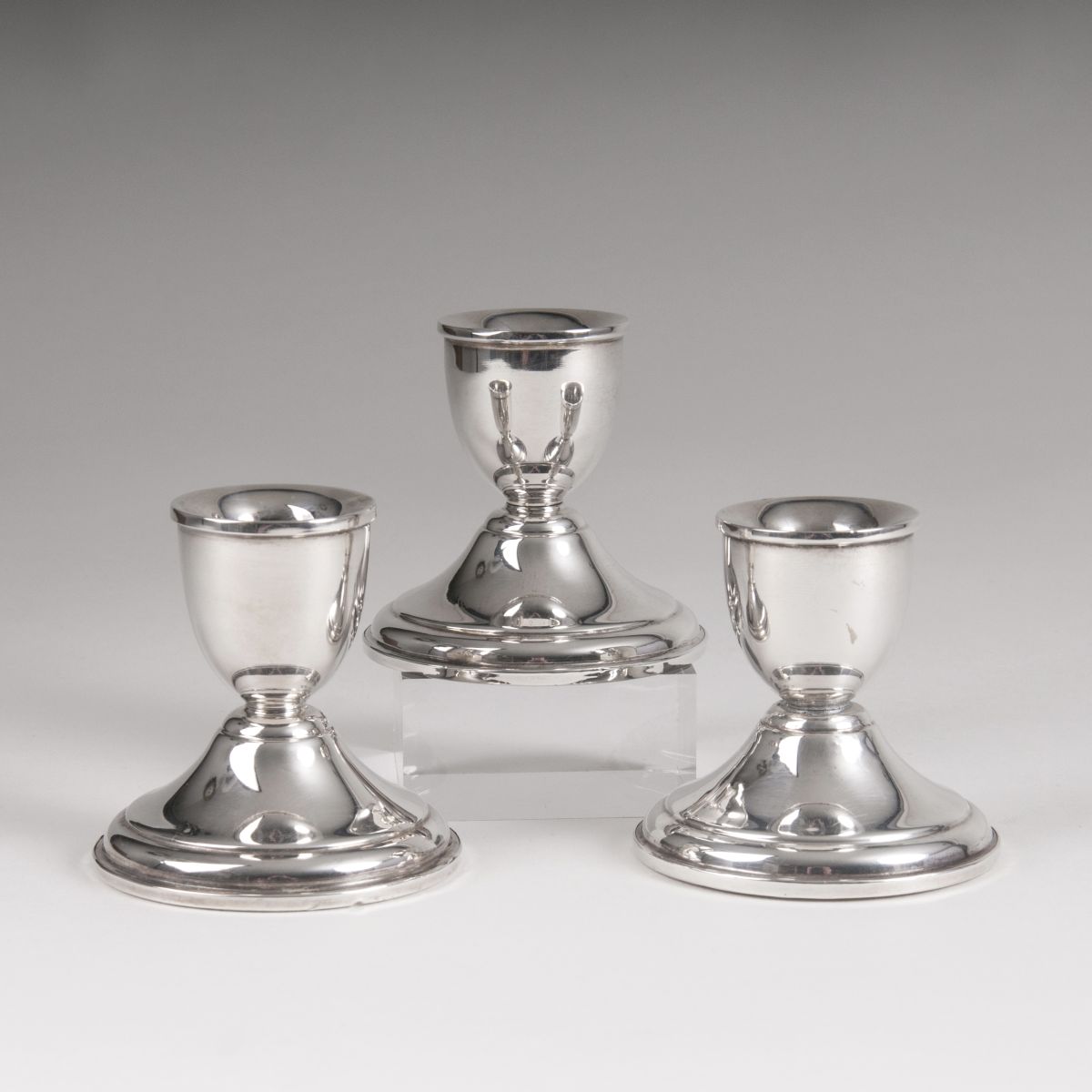 A set of 3 small candlesticks