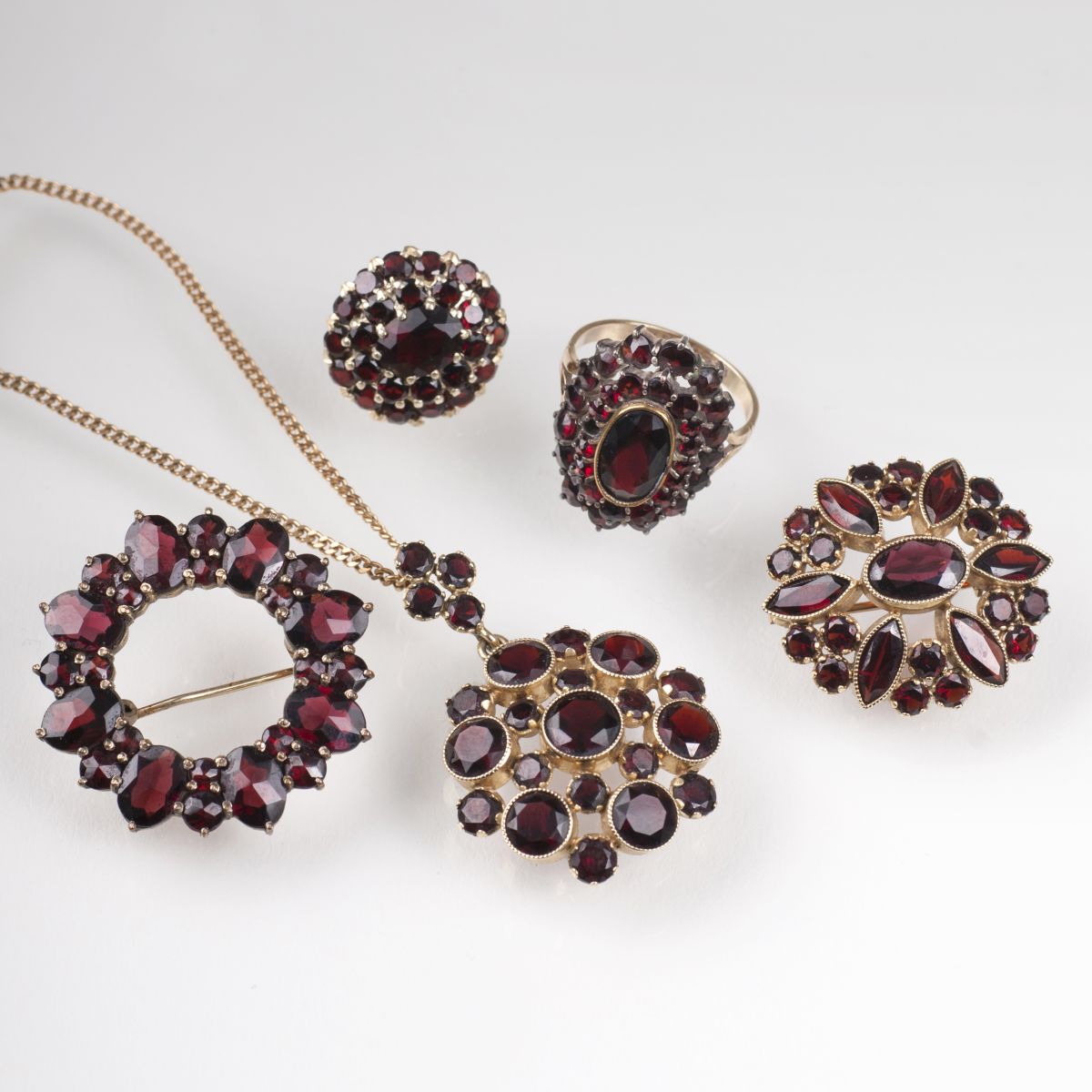 Five pieces of garnet jewelry