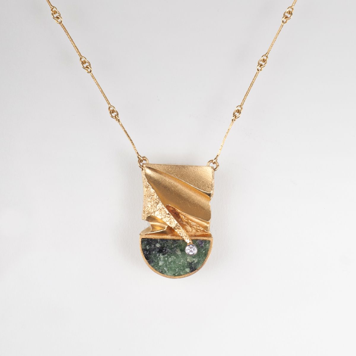 A modern necklace with zoisite diamond pendant by Björn Weckström
