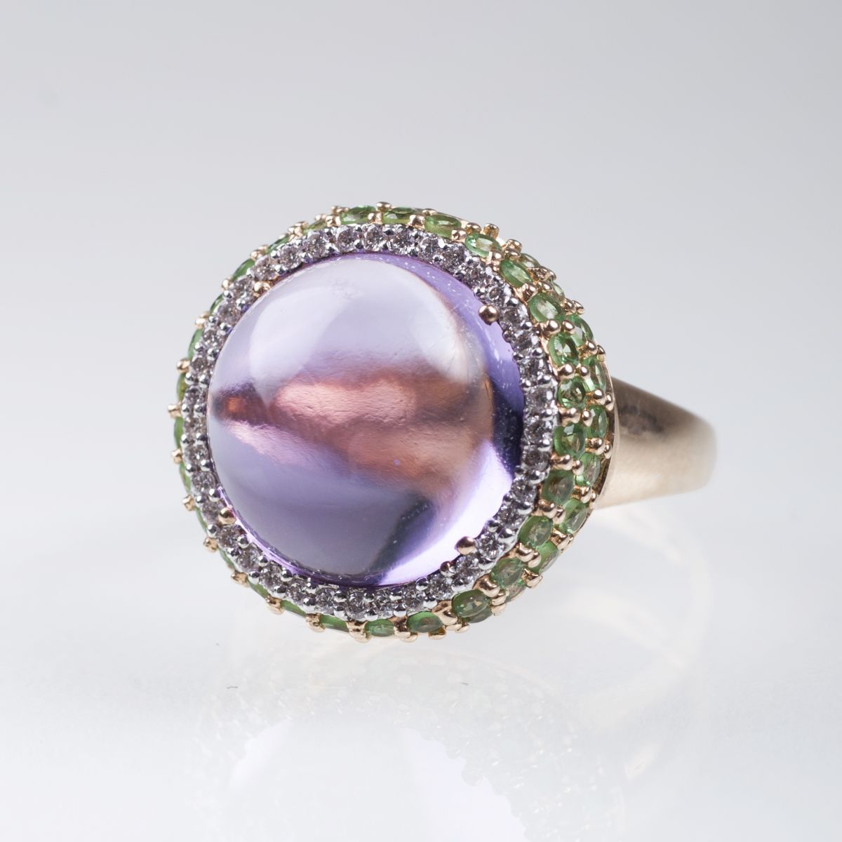 An amethyst tsavorith ring with small diamonds