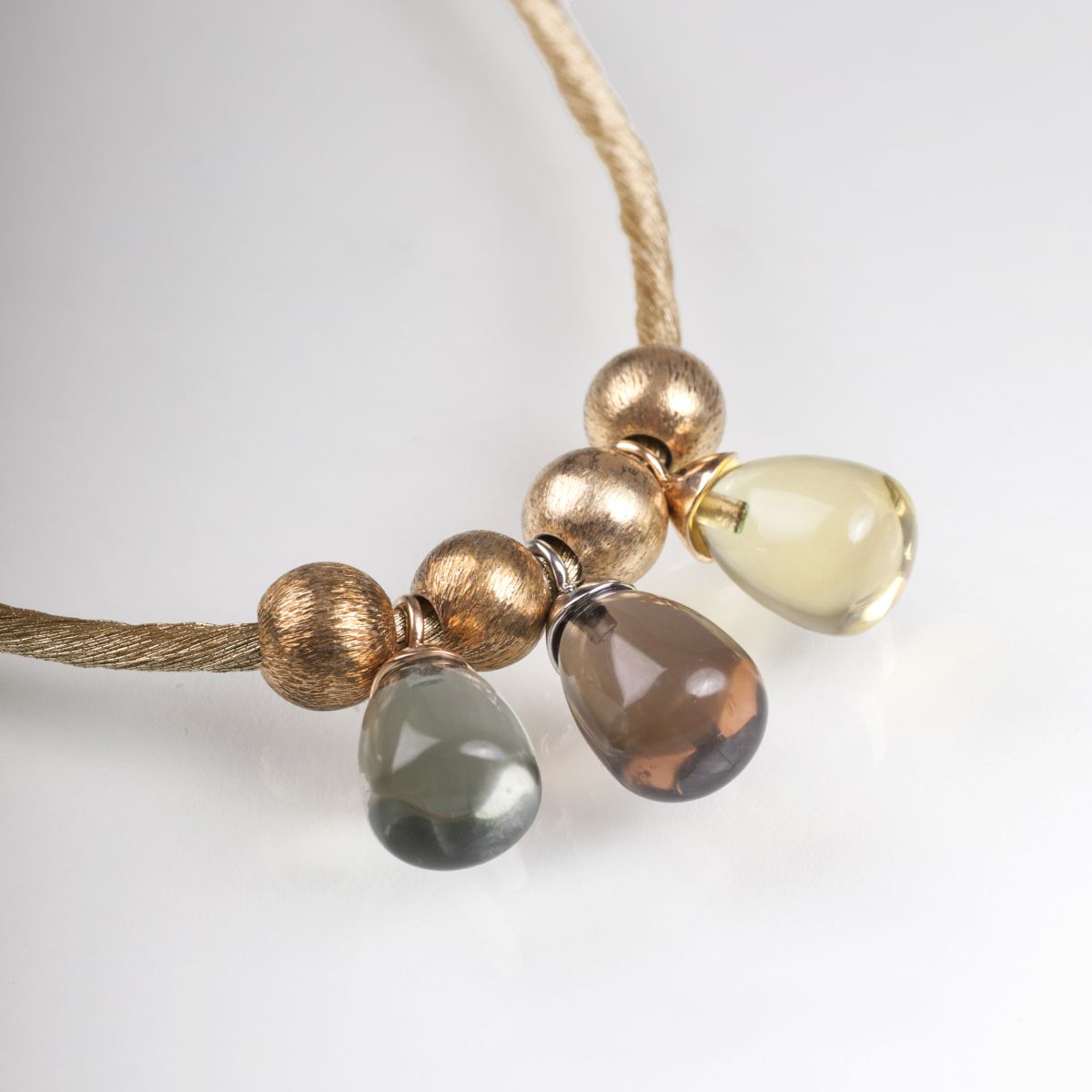 A necklace with multicoloured gemstone pendants