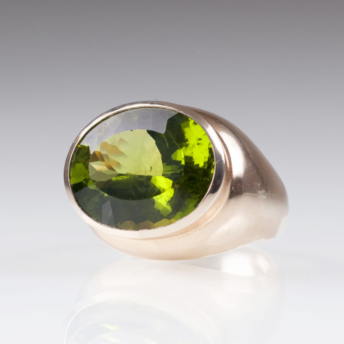 A modern peridot ring