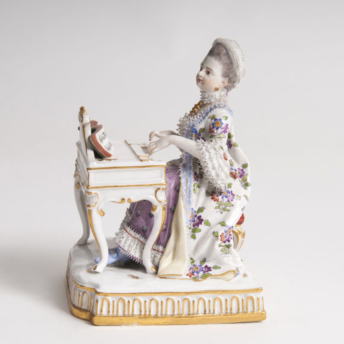 A Porcelain Figure 'A Lady at the Spinet'