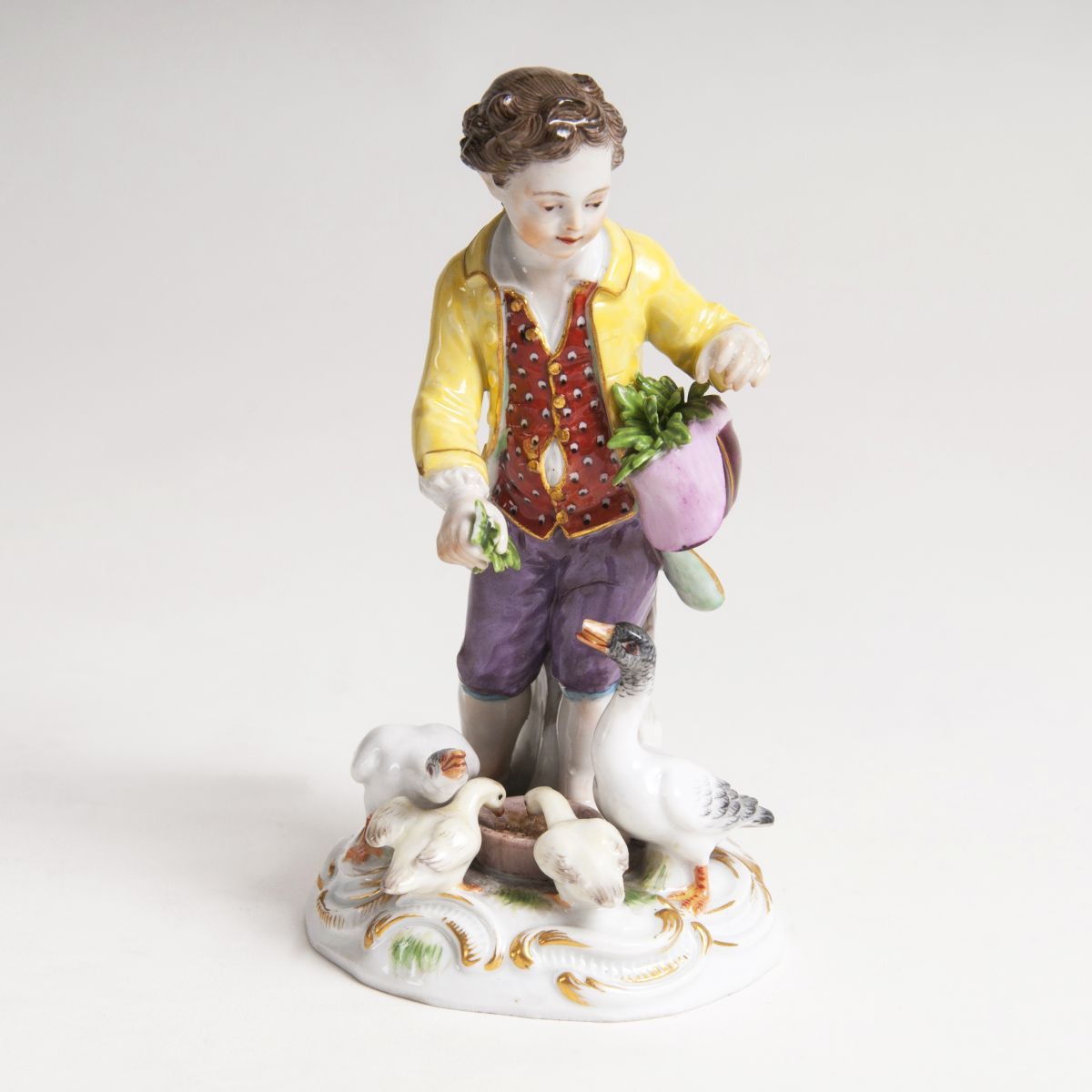 A porcelain sculpture 'A Boy, fedding the Geese'
