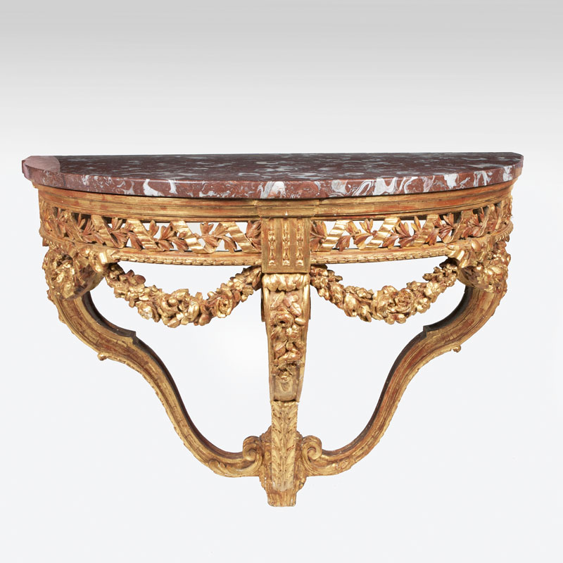 A large magnificent Louis-Seize console table with rich sculptural work
