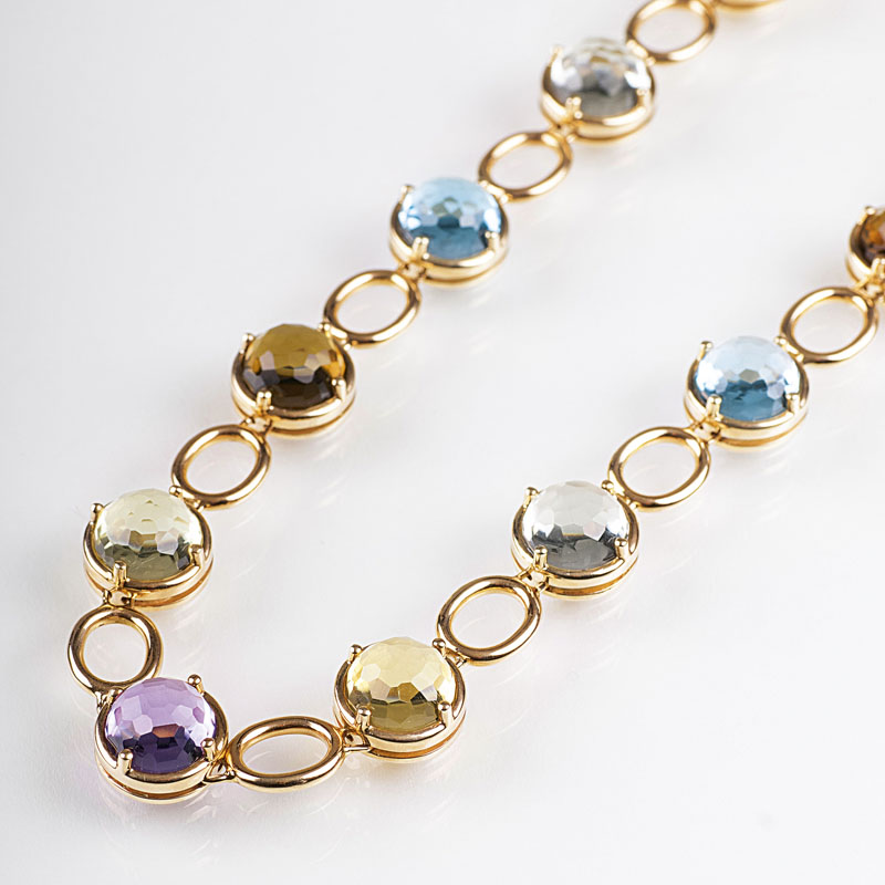 A modern, fine necklace with coloured gemstones