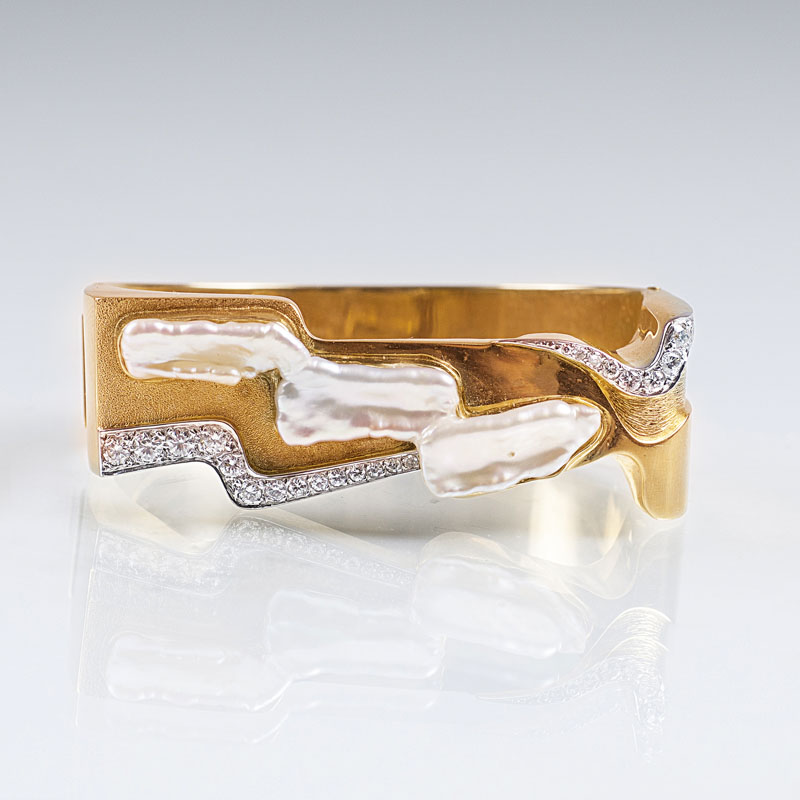 A Vintage golden bangle bracelet with diamonds and mother-of-pearl