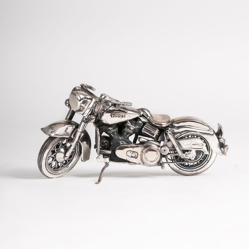 A small rare motorcycle model 'Harley Davidson' in silver