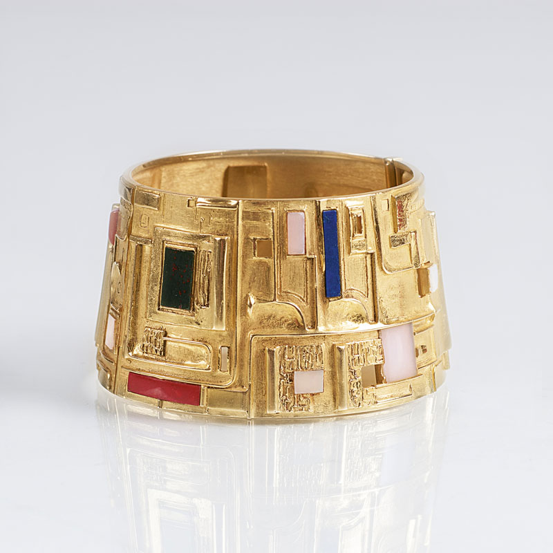 A wide Vintage golden bangle bracelet with semiprecious stones by Walter Erkckert