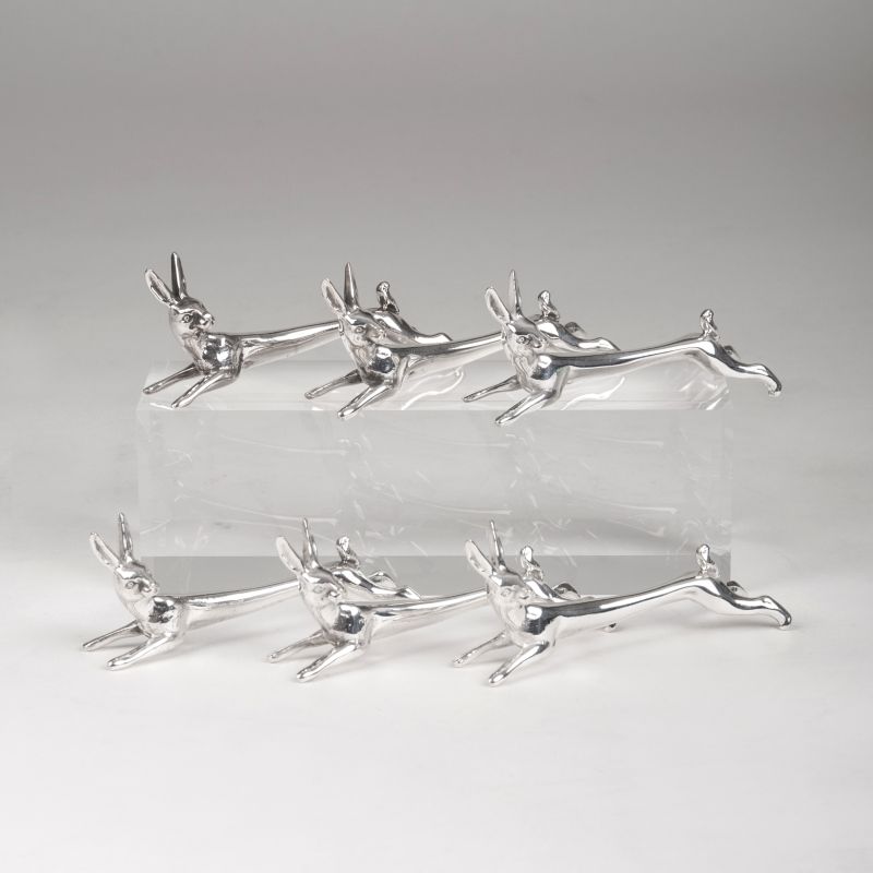 A set of silver rabbit-shaped knife rests