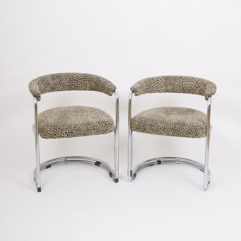 A pair of Mid Century chrome-cantilever chairs