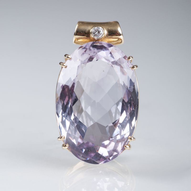 A large amethyst pendant with diamond