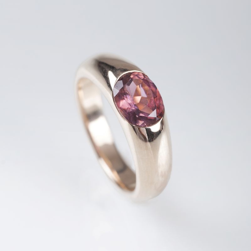 A gold ring with pink-tourmaline
