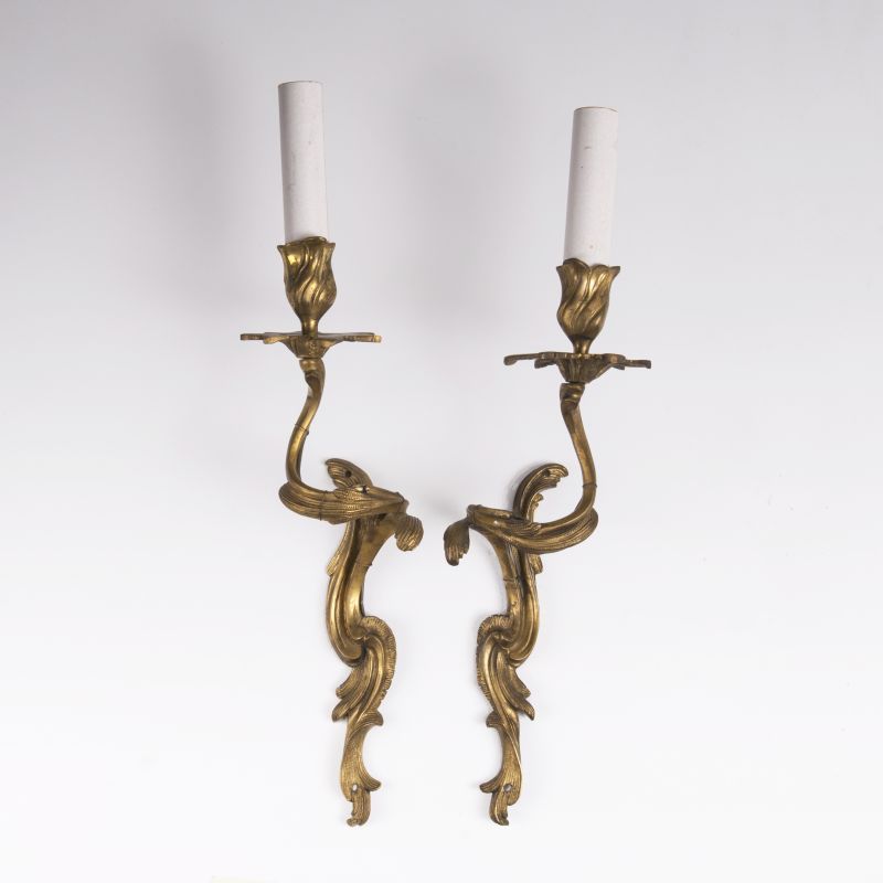 A pair of onearmed gilded wall applications in a baroque style