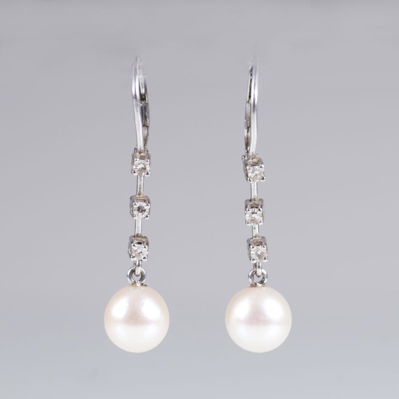 A pair of petite diamond perl earrings