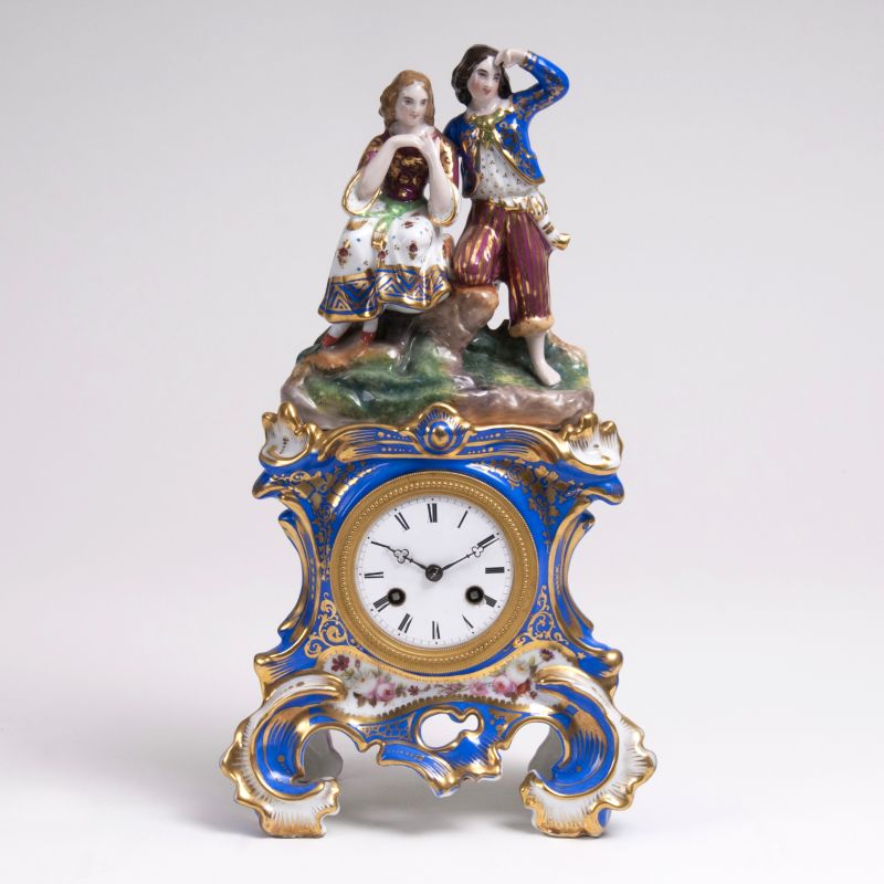 A Porcelain Mantle Clock with Figural Finial