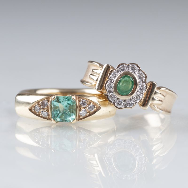 Two emerald diamond rings