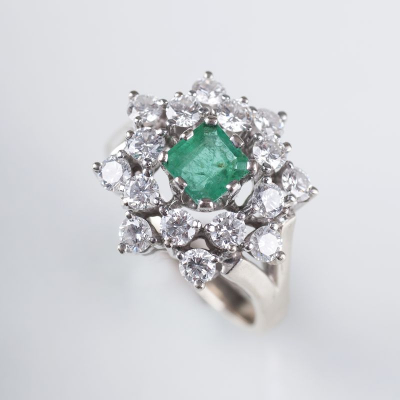 An emerald diamond ring