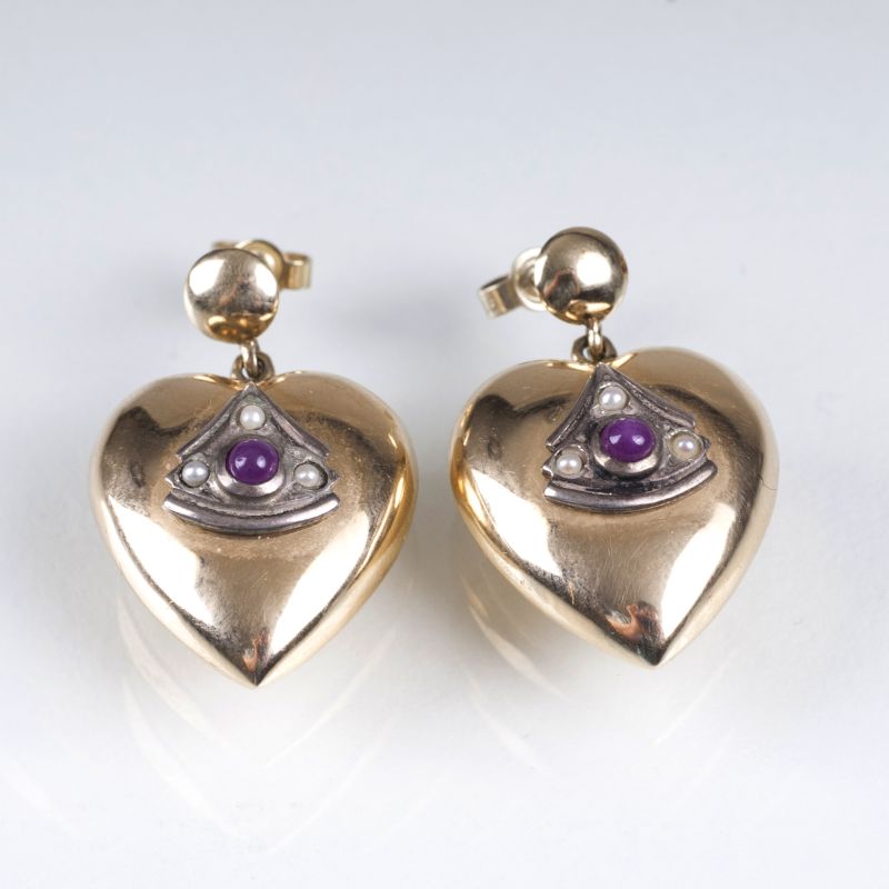 A pair of antique heart pendants with rubies and seed pearls as earrings