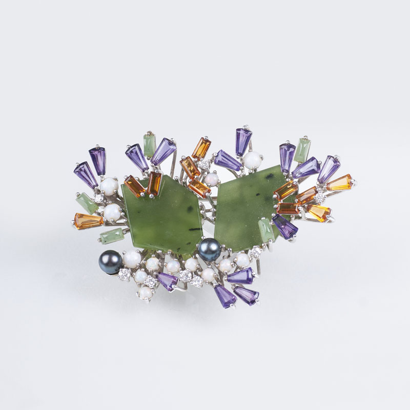 A Vintage brooch with nephrite, coloured gemstones and diamonds