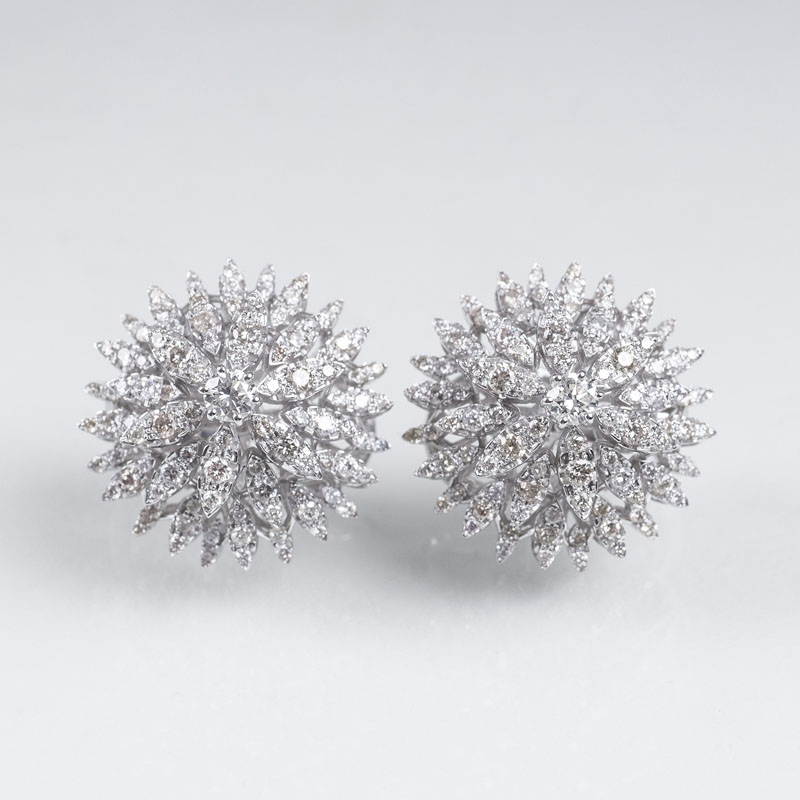 A pair flowershaped diamond earrings