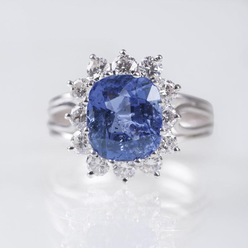 A precious ring with one natural sapphire and diamonds