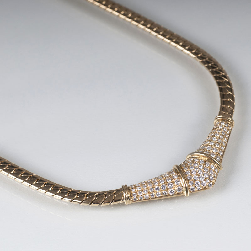 An elegant gold necklace with diamonds
