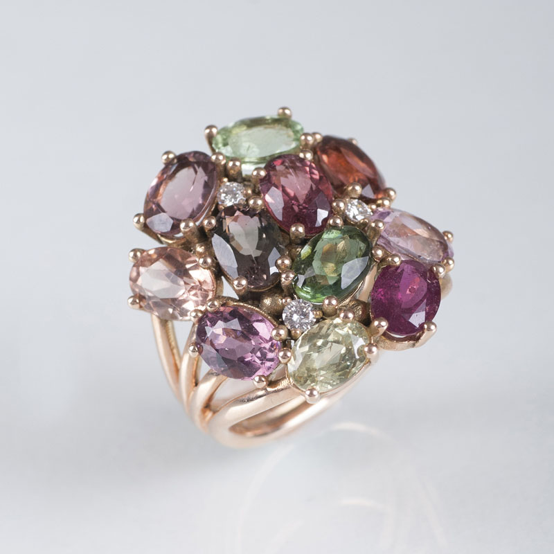 A colourful flower shaped precious stone ring