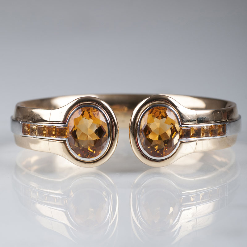 An elegant gold platinum bangle bracelet with citrine