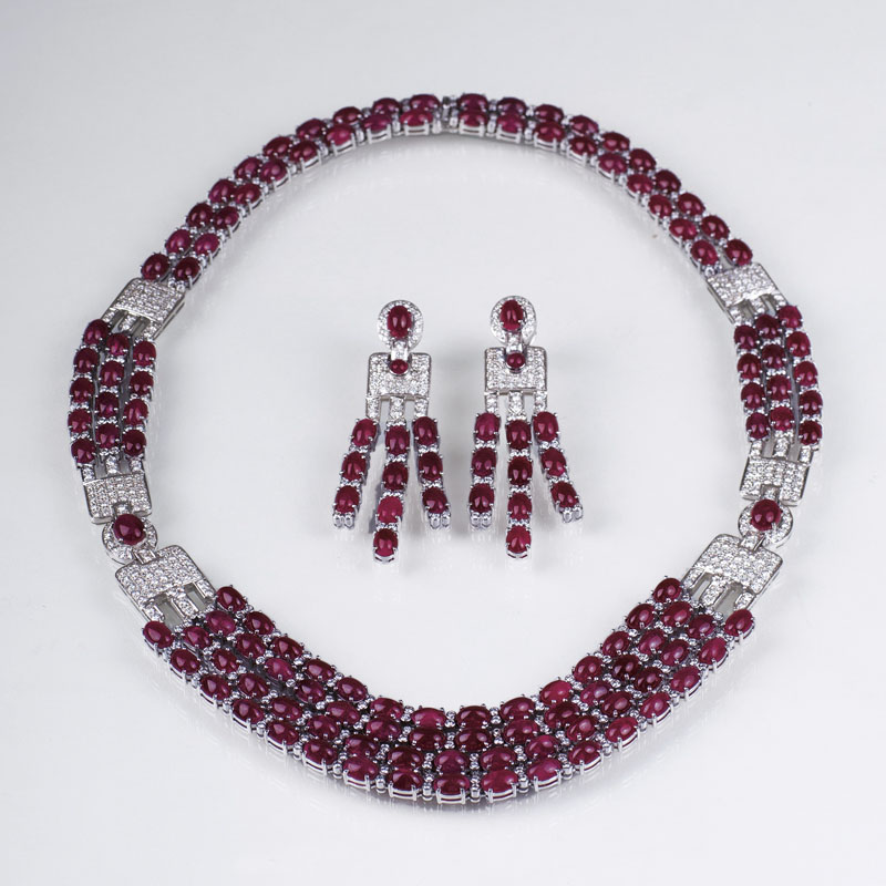 A highcarat ruby diamond demi parure with necklace and a pair of earrings