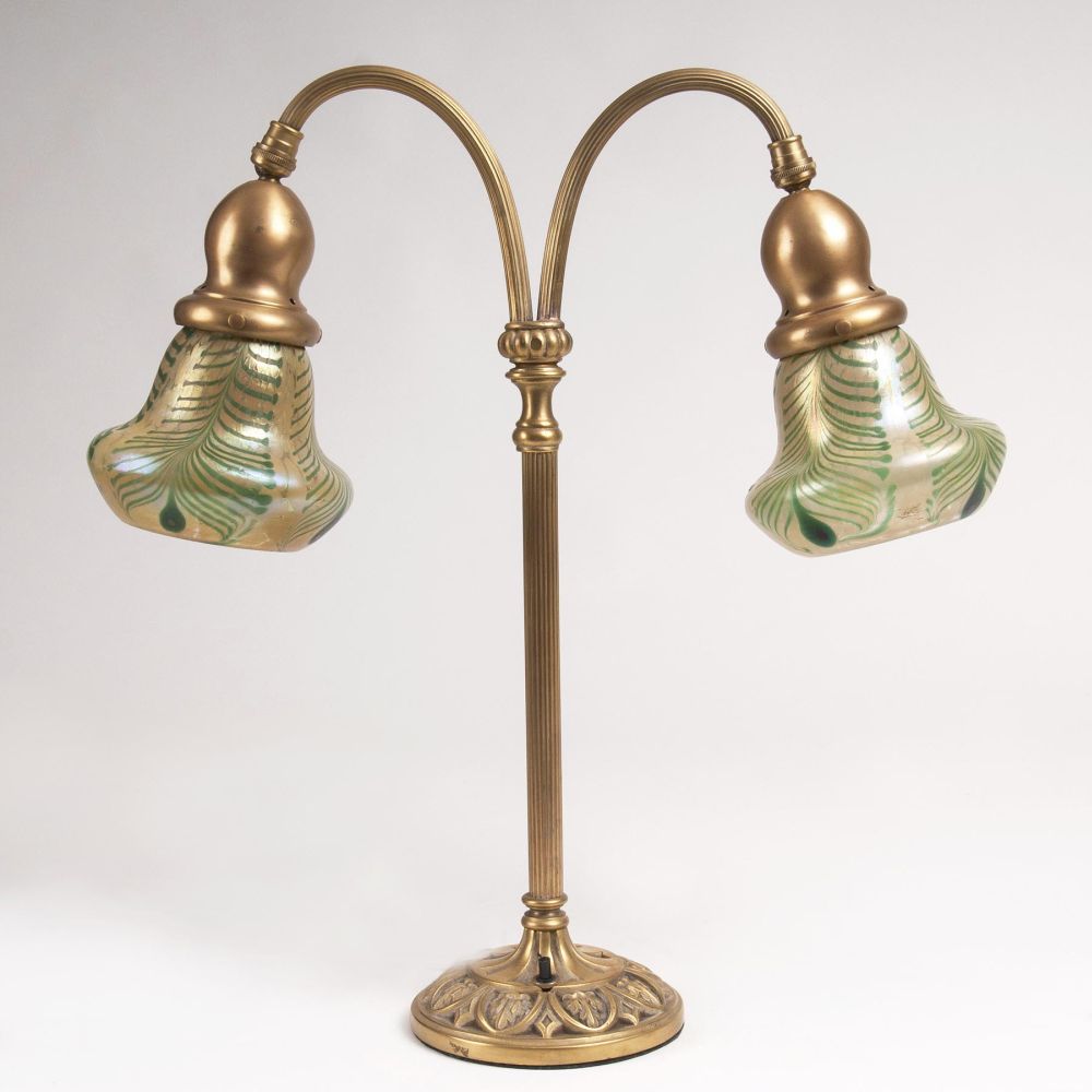 An Art Nouveau Table Lamp with iridescent glass shades