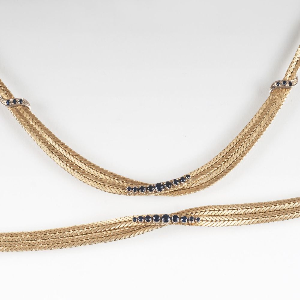 A Gold Necklace with matching Bracelet