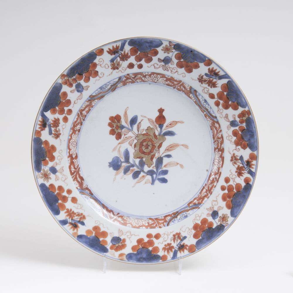 An Imari-plate with peonies and pomegranates