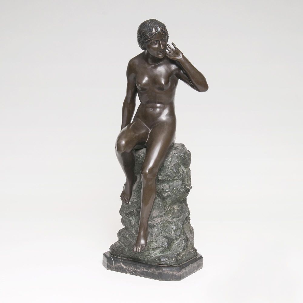 A Figure 'Female Nude sitting on a rock'