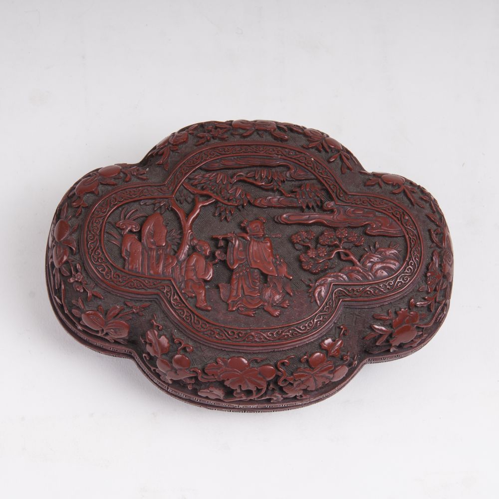 A Quatrefoil Red Lacquered Box with Figural Decor
