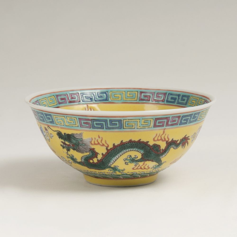 A Small Bowl with Dragon Decor against yellow ground
