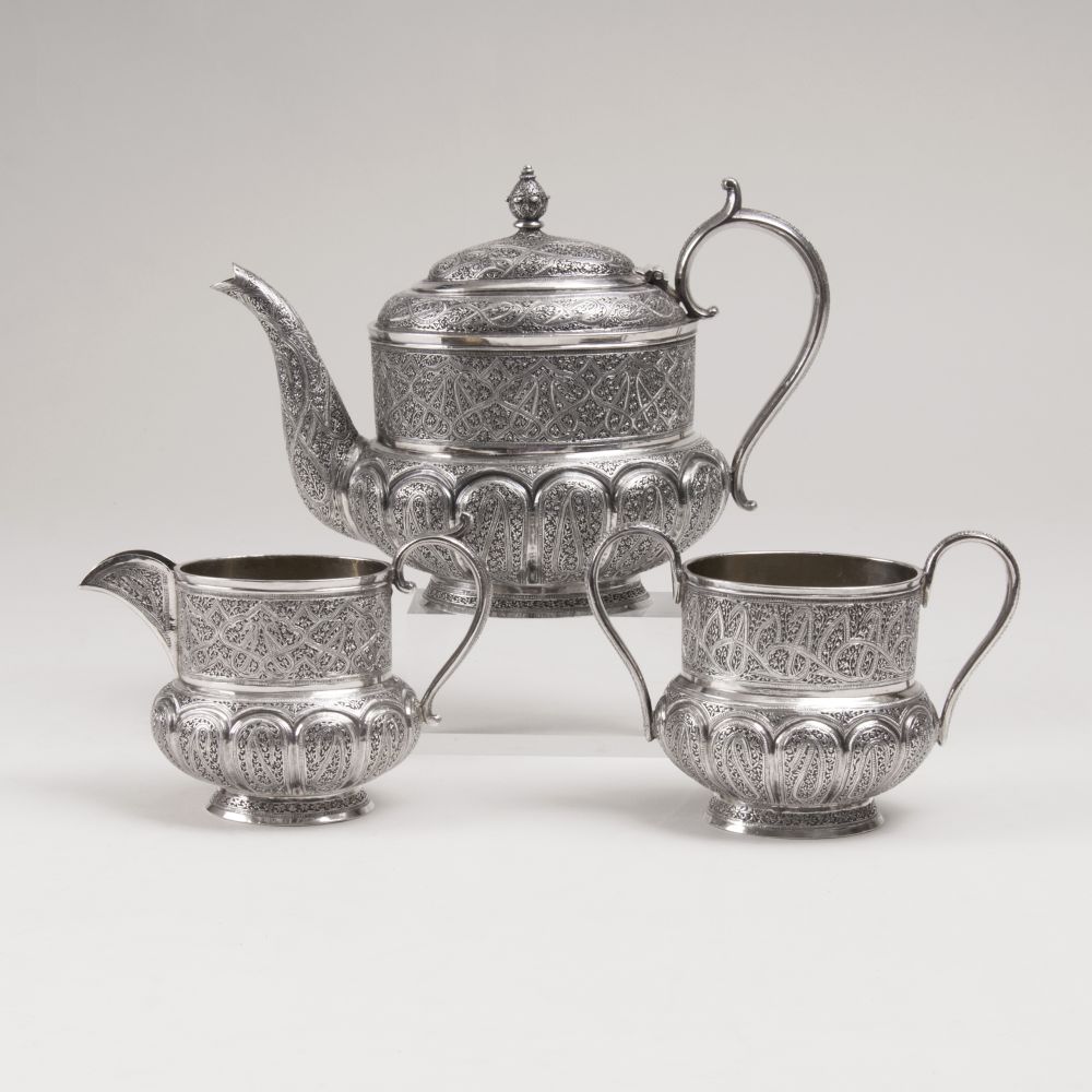 A Silver Tea Service with rich Ornamental Engraving Decor