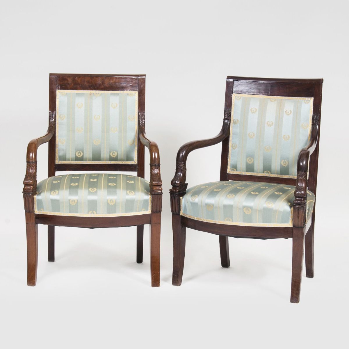 A Pair of Biedermeier Armrestchairs with Dolphin Decor