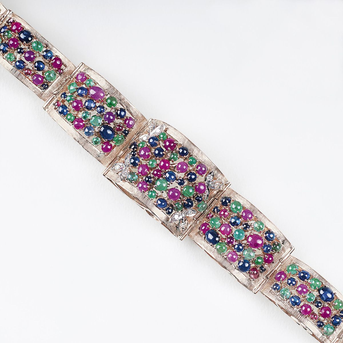 A Gold Bracelet with Rubies, Emeralds and Sapphires