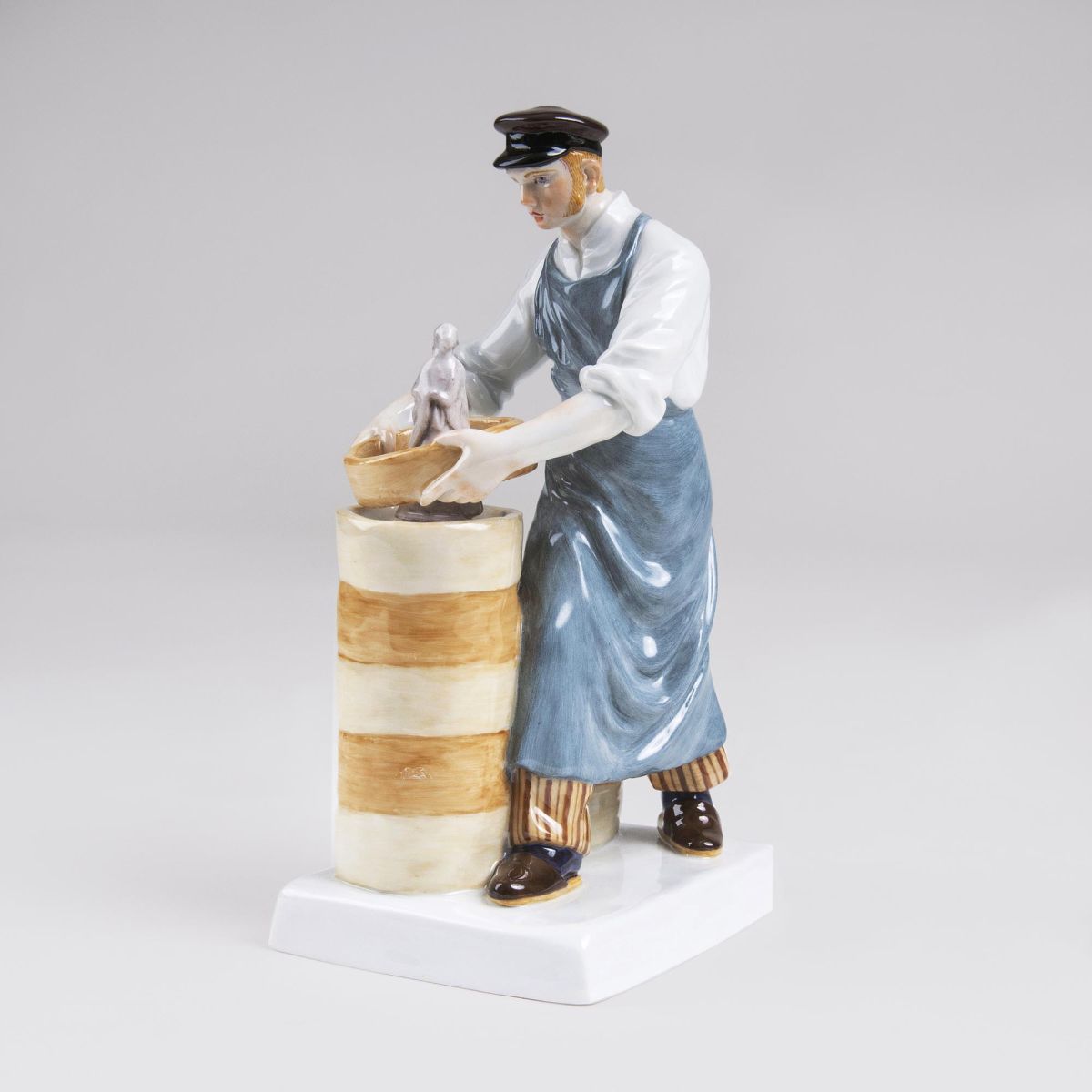 Figur 'Kapselsetzer bei der Porzellanherstellung'
