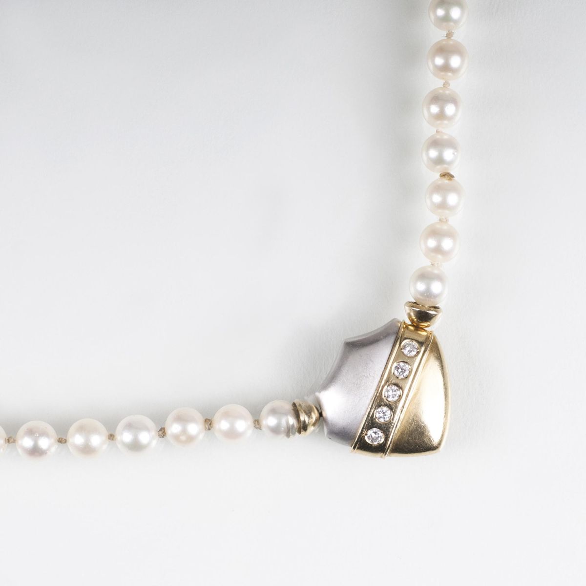 A Pearl Necklace with Diamond Clasp A Pearl Necklace with Diamond Clasp