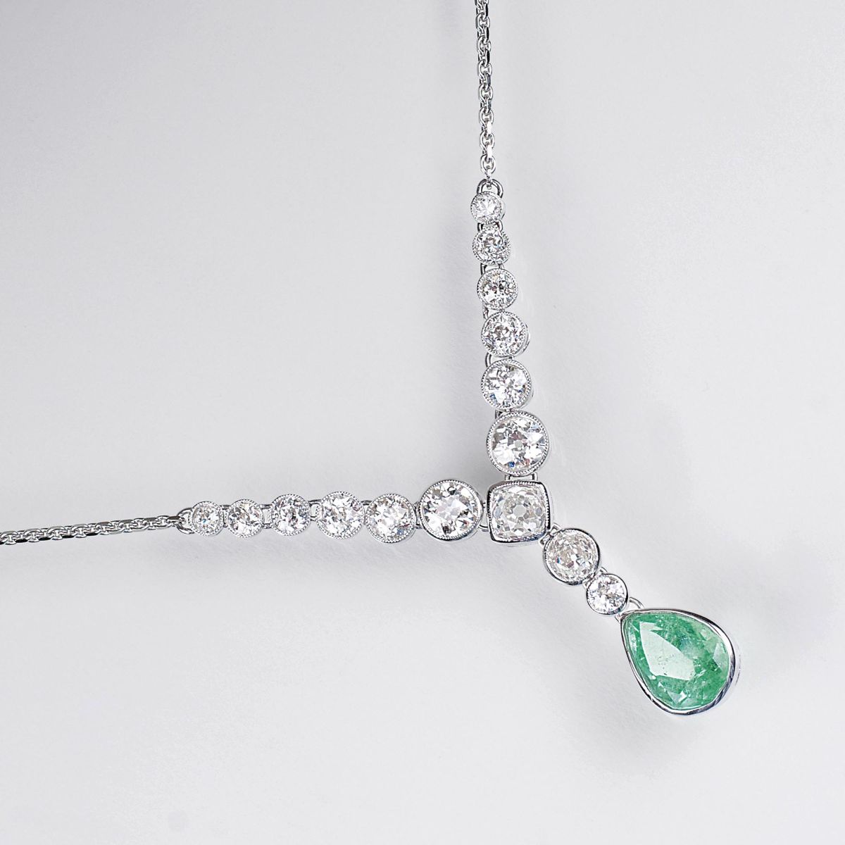 An Emerald Pendant with Old European Cut Diamonds on Necklace