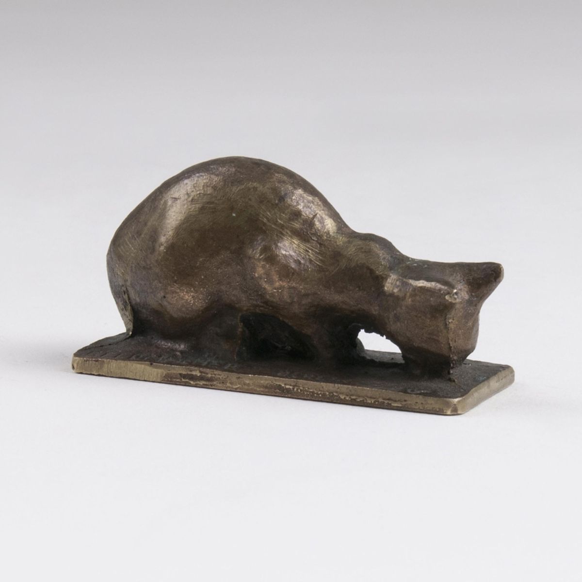 A Small Animal Bronze 'Drinking Cat'