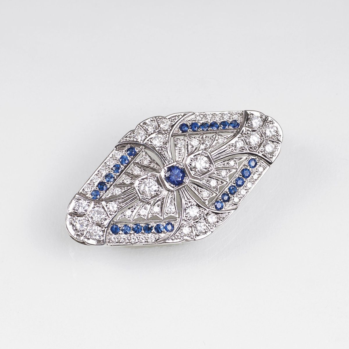 A Diamond Sapphire Brooch in the style of Art-Déco