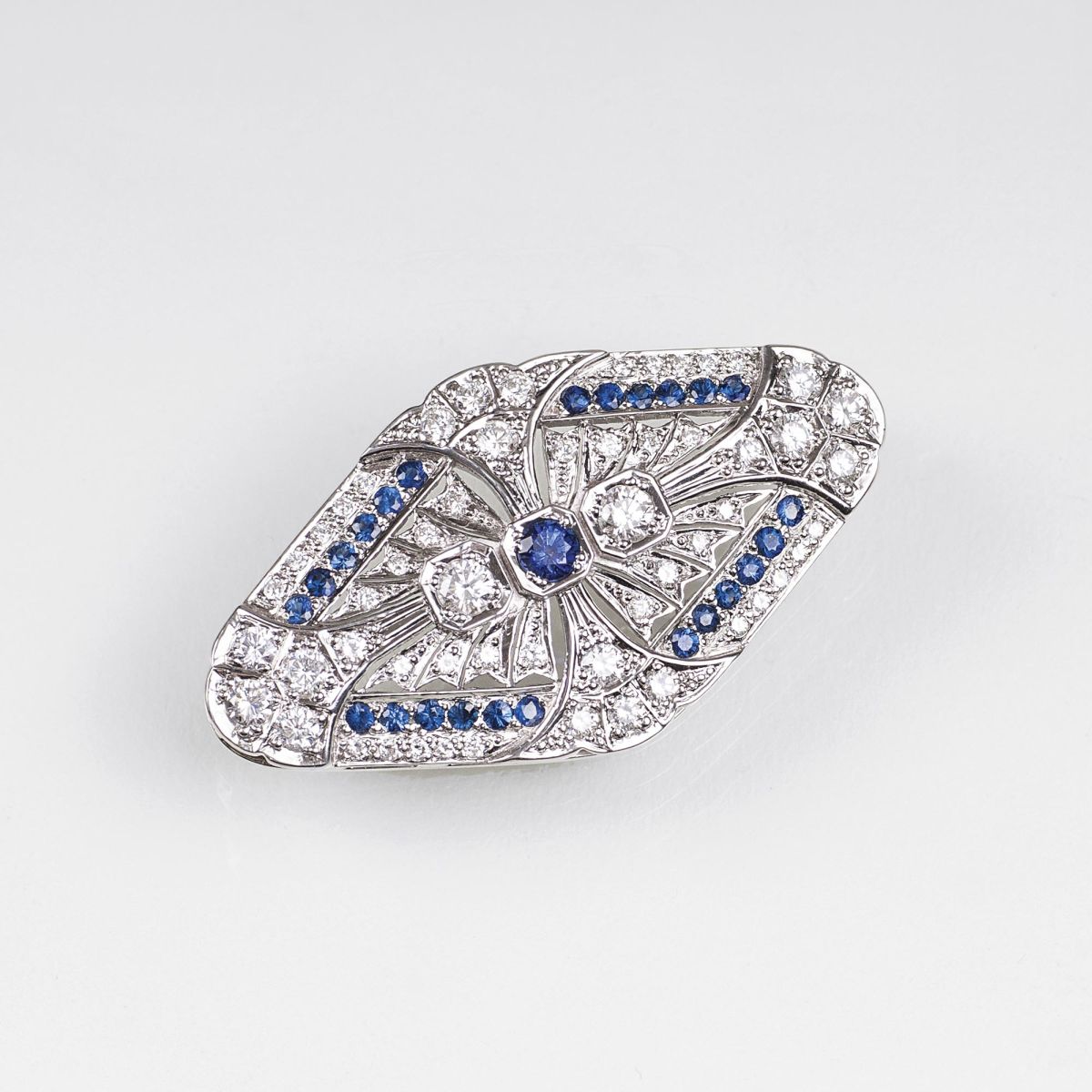 A Diamond Sapphire Brooch in the style of Art-Déco A Diamond Sapphire Brooch in the style of Art-Déco