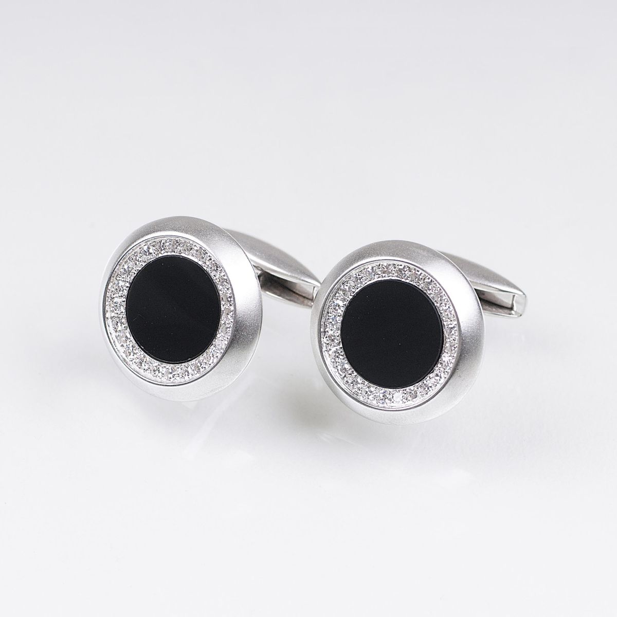 A Pair of Onyx Diamond Cufflinks